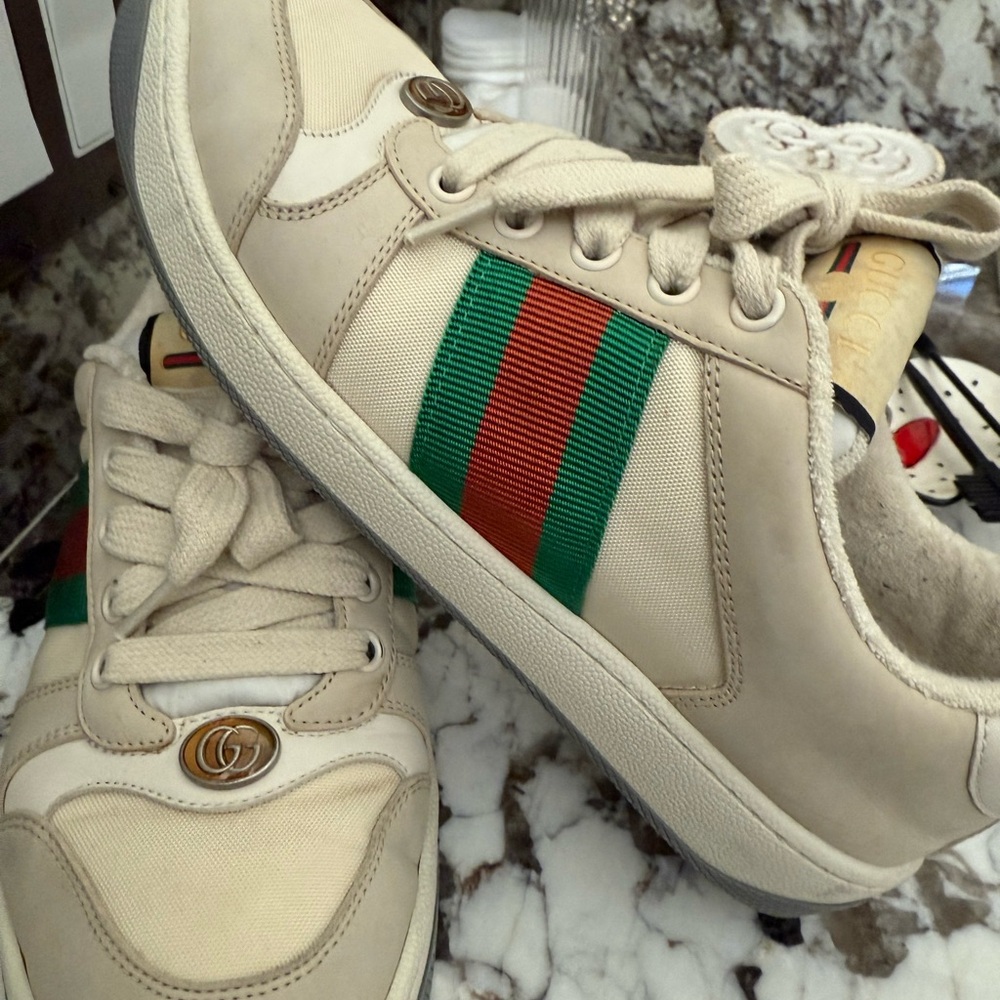 Gucci Cream Sneakers with Green and Red Accents.